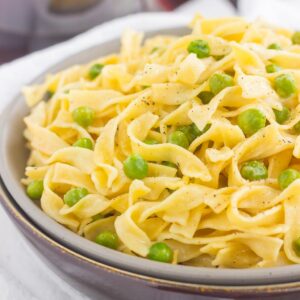 These Creamy Skillet Noodles with Peas are made in one pan and ready in less than 30 minutes. With just a few ingredients, this creamy and flavorful side dish is perfect when paired with just about anything!